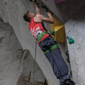 Will Ruane on a rock climbing wall