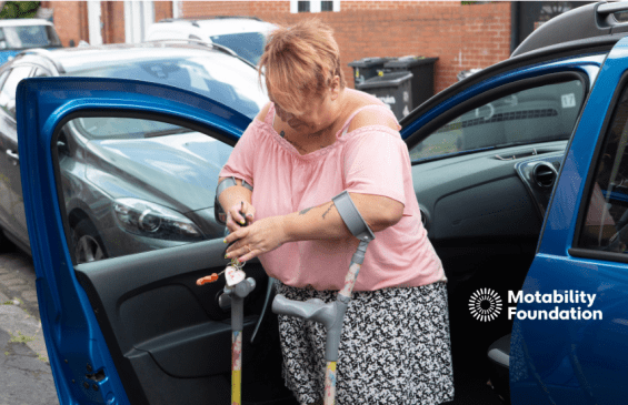 A woman is pictured getting in and out of a car using crutches.